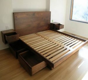 Finished wooden bed frame project showing furniture plans available in TedsWoodworking